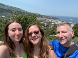 2 women and a man smiling