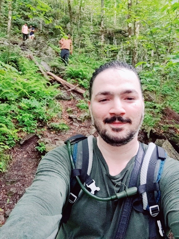man taking selfie in woods