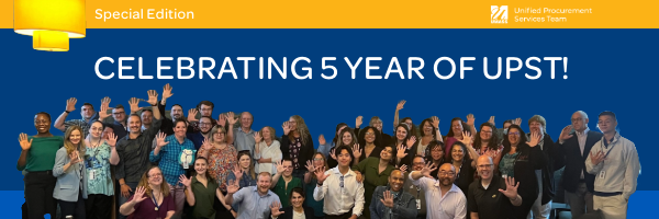 Group of UPST employees with a blue background and "Celebrating 5 Year of UPST" in the background