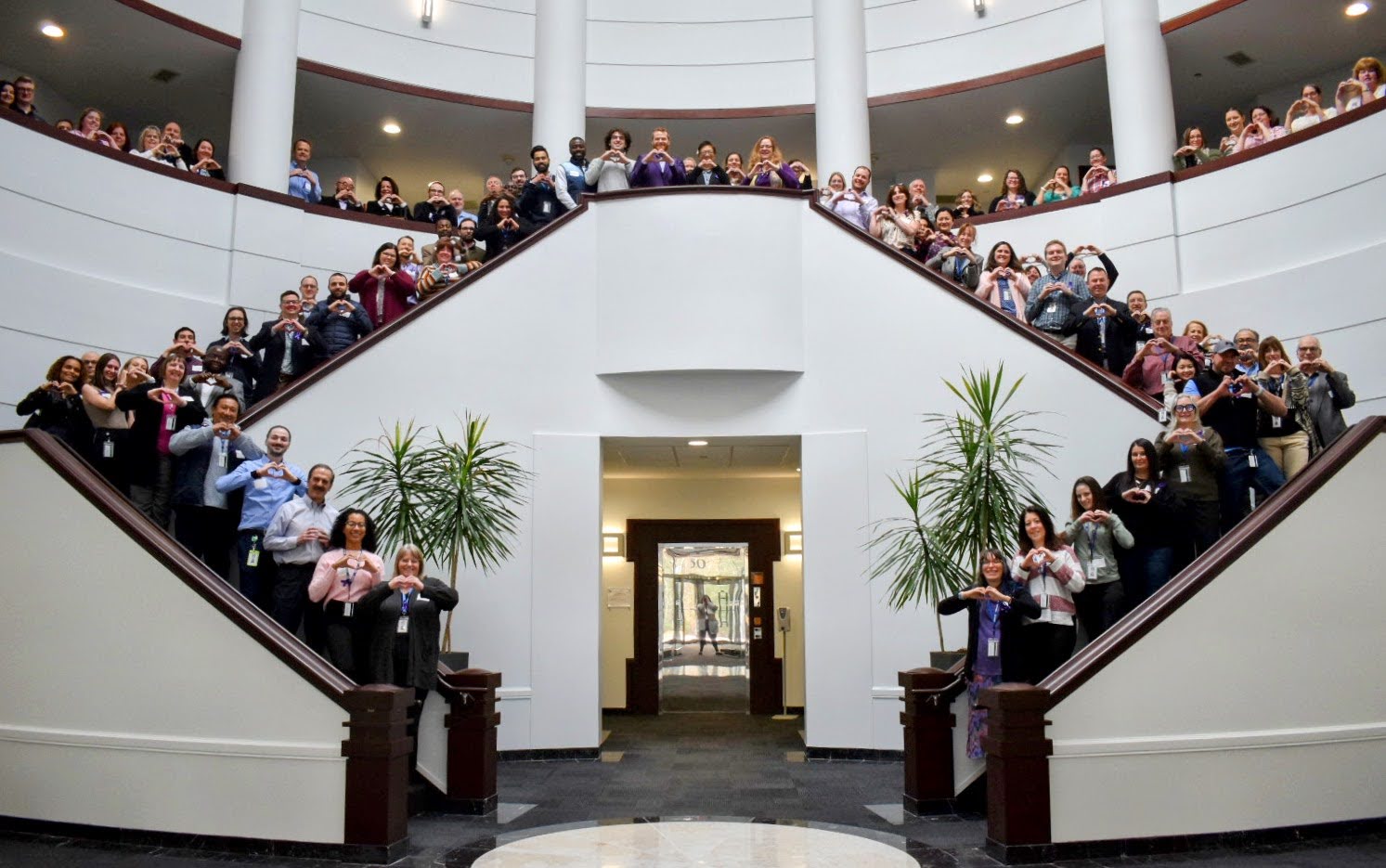 Group photo of UMPO making heart sign with their hands