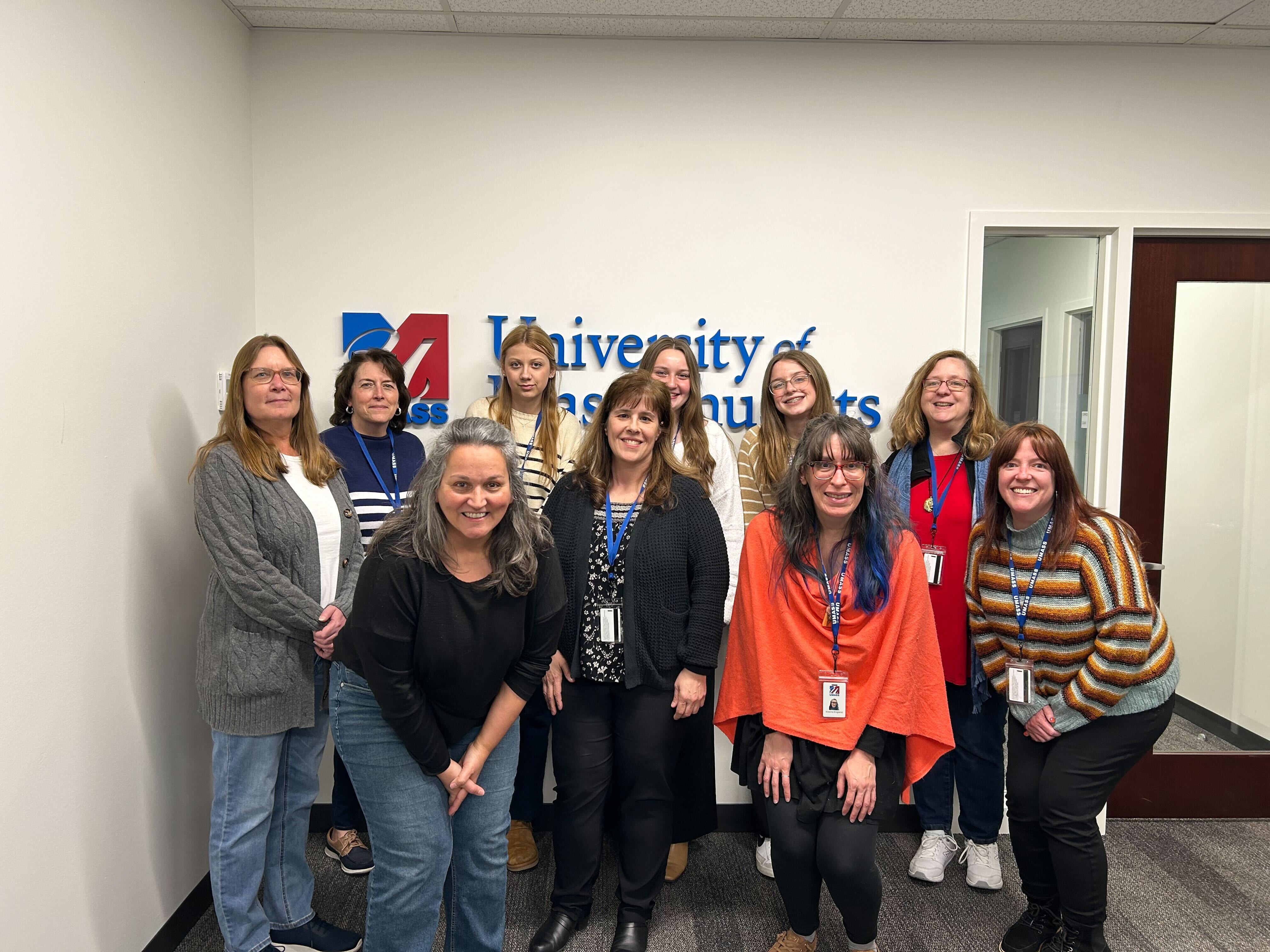 Group of students and employees posing for picture