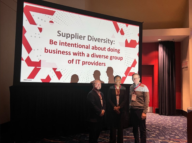 David Cho, Amanda Onwuka, and David Nero standing in front of a screen