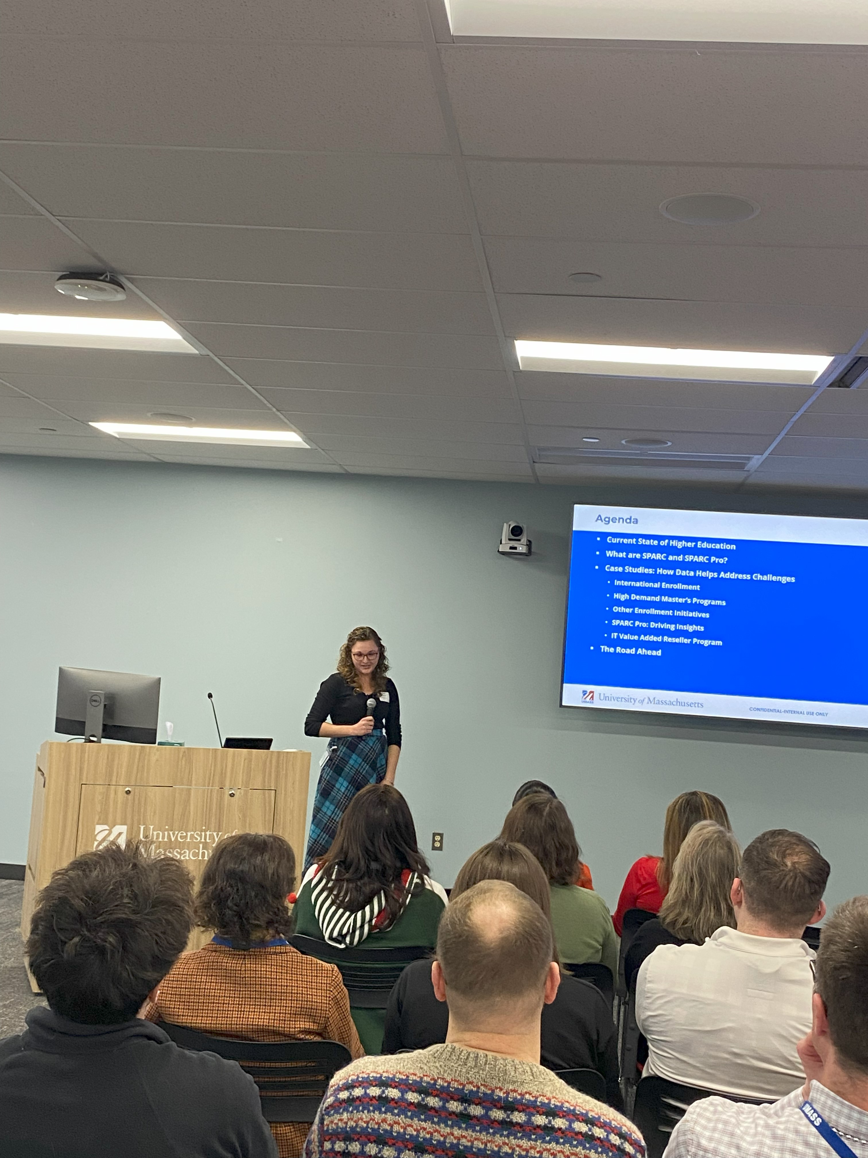 Deirdre Delaney presenting to a group in front of a large screen