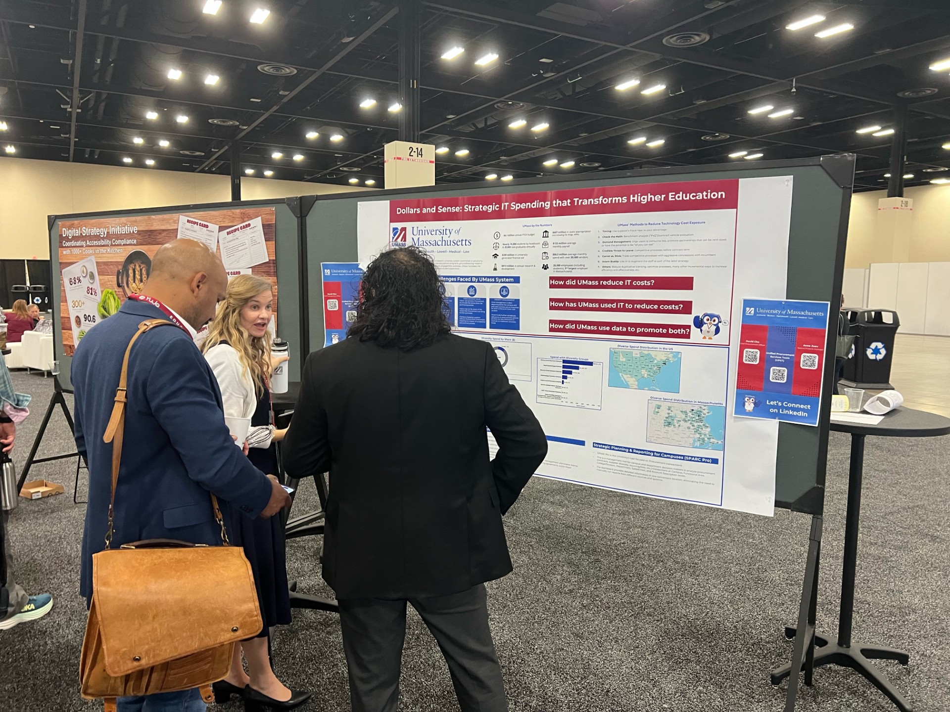 Three people talking in front of a poster with SPARC Pro Research