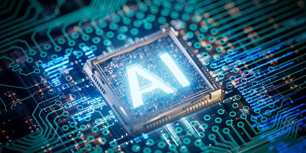computer microchip with the glowing words "AI" centered