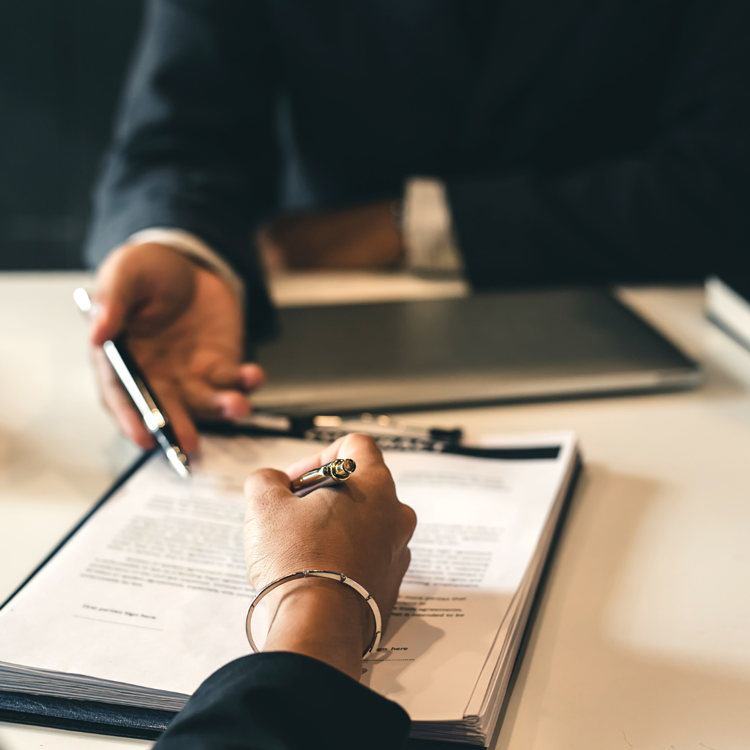 a person signing a document