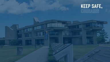 UMass Dartmouth campus with blue overlay and keep safe message
