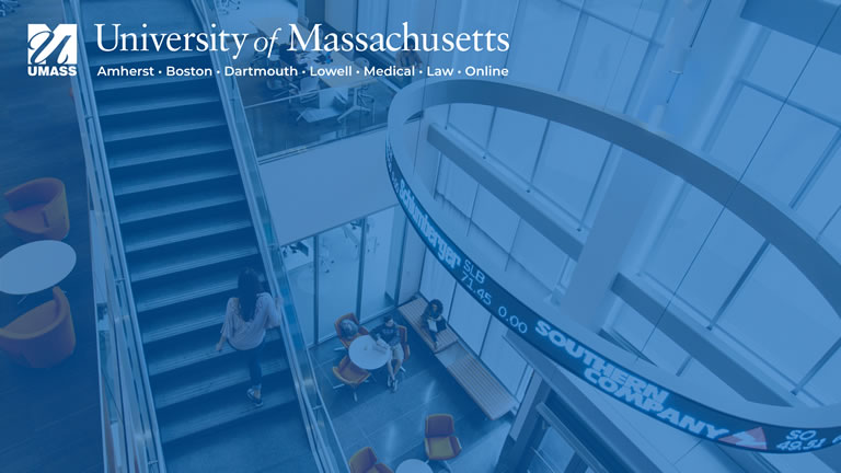 interior of umass lowell's manning school of business with umass logo and blue overlay