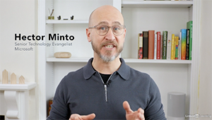 Hector Minto from Microsoft speaks while gesticulating with his hands.