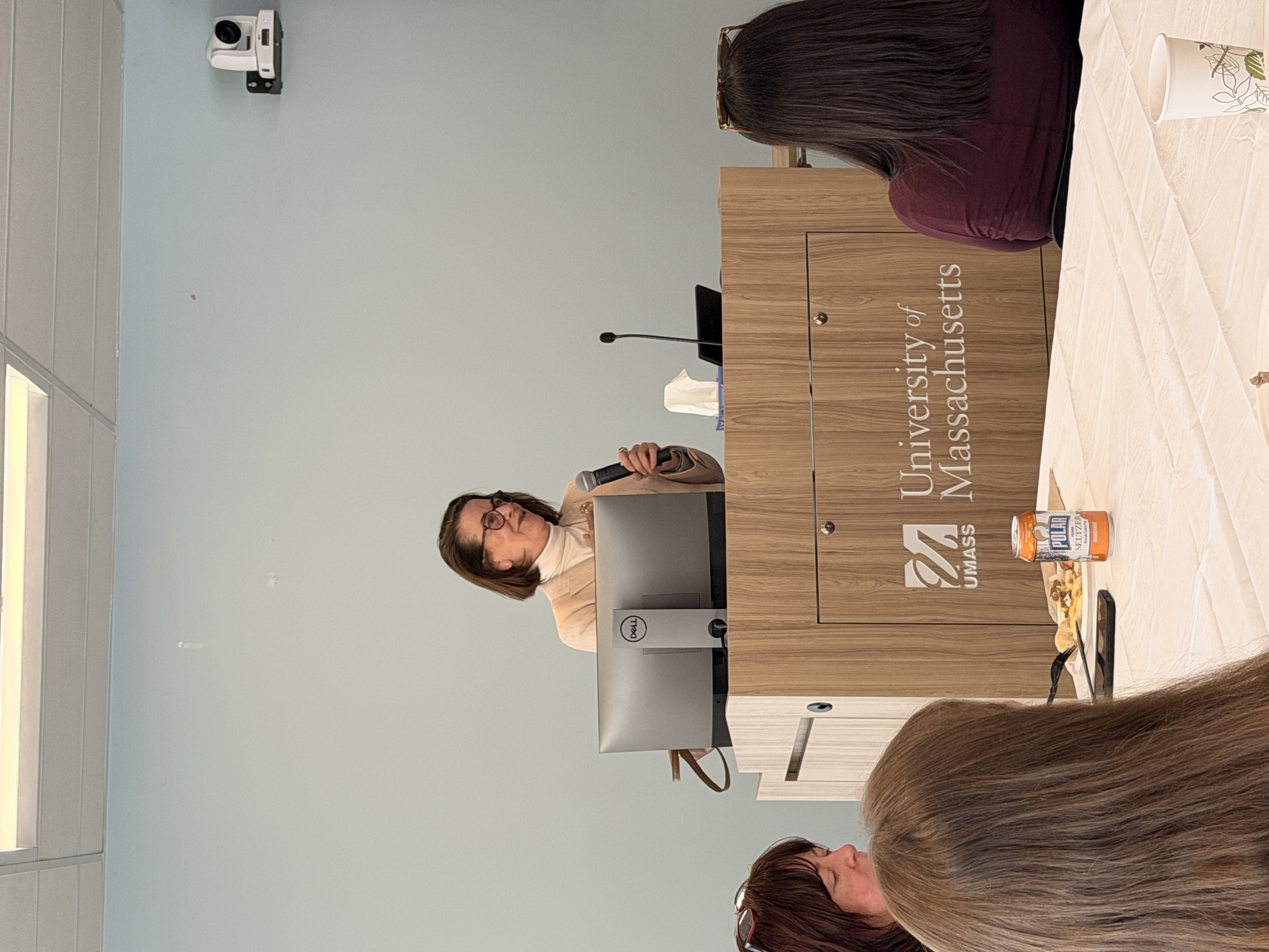 Denise Barton presenting behind a podium