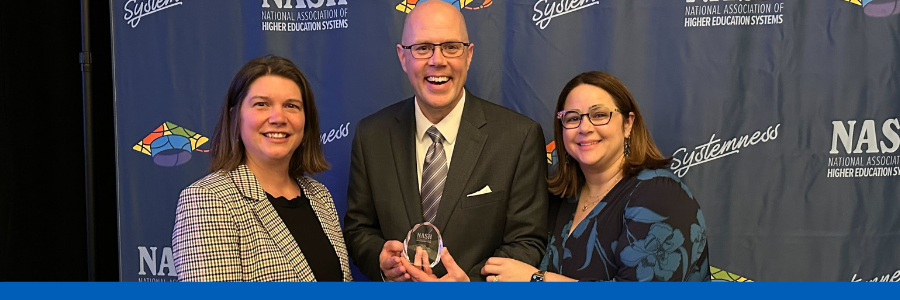 Photograph of Associate Vice President LeeAnn Pasquini, Chief Procurement Officer Michael Durkin, and NASH Interim President Jessica Todtman posing with NASH Award.