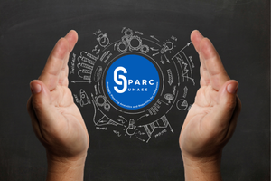 Hands surrounding a logo for SPARC with chalk drawings of a variety of charts and measurements