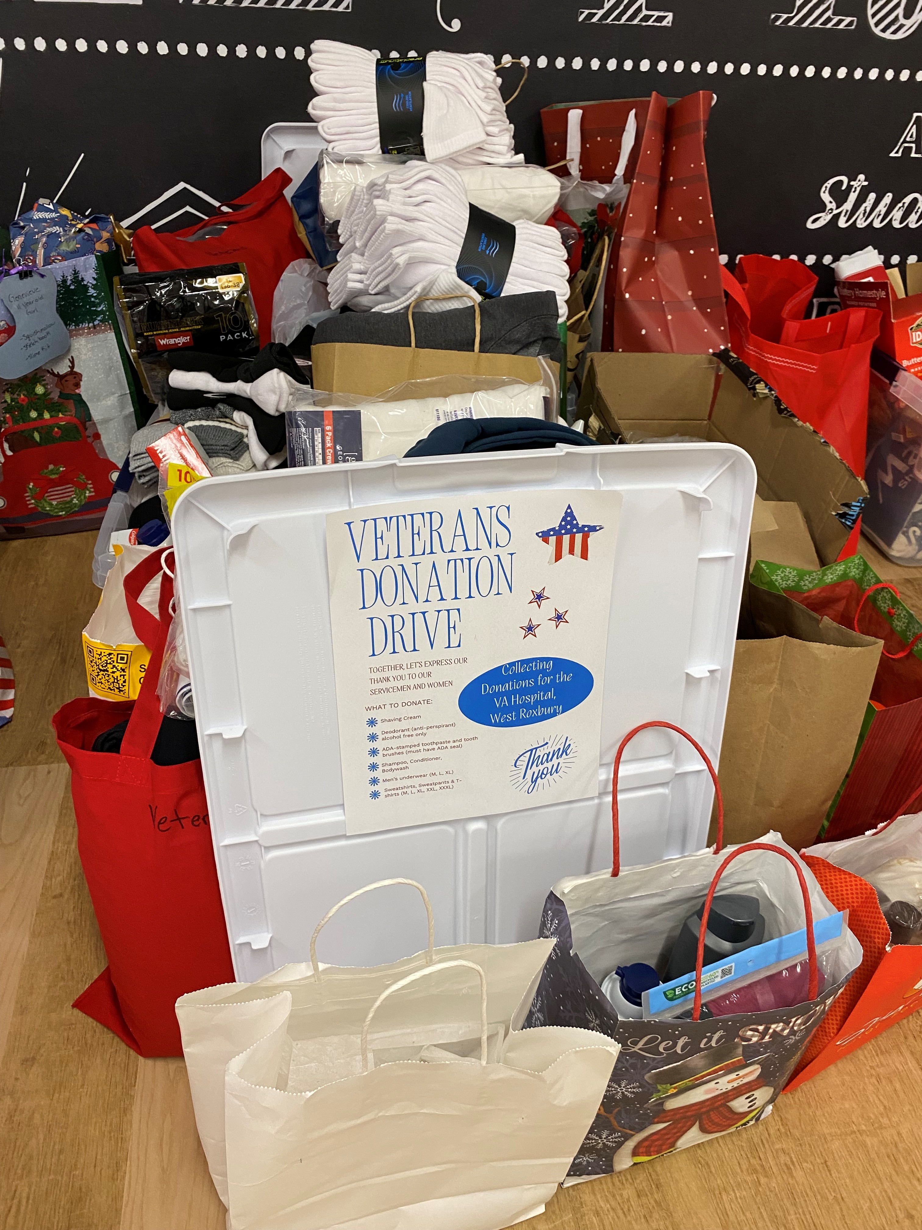 A stack of donations to bring to VA hospital