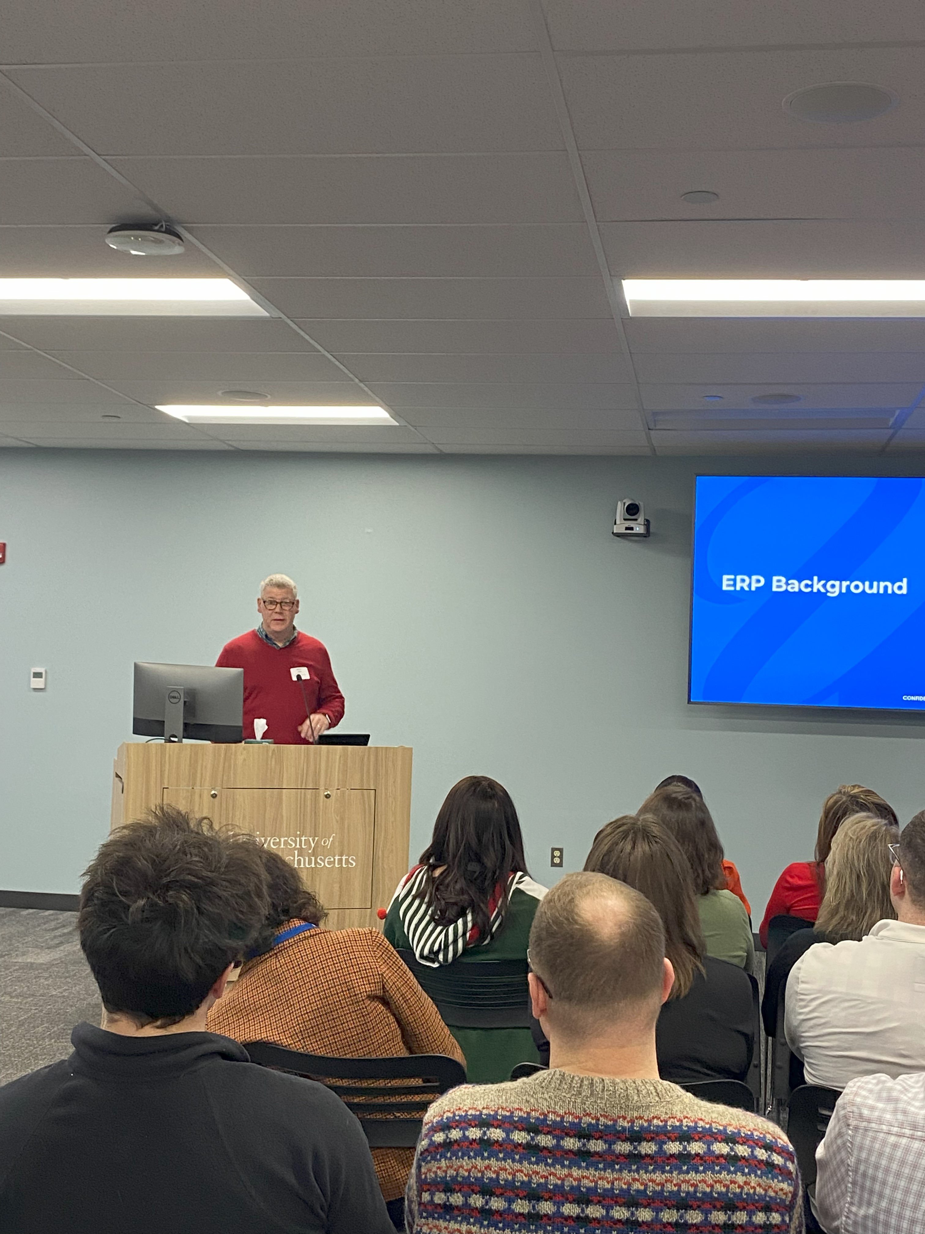 Jeff Gull presenting to a group from a podium