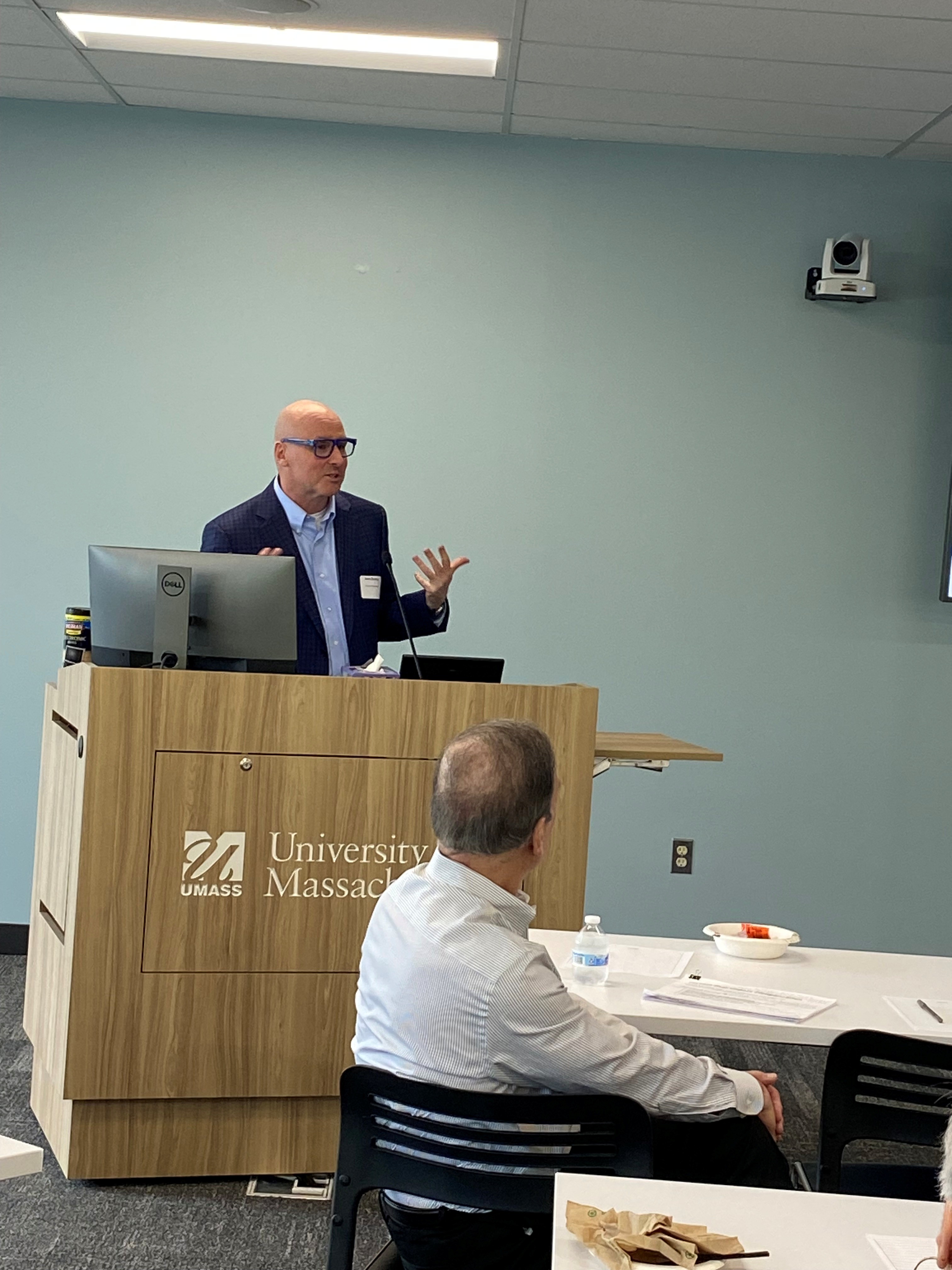 John Dunlap, Chief Human Resources Officer presenting behind a podium