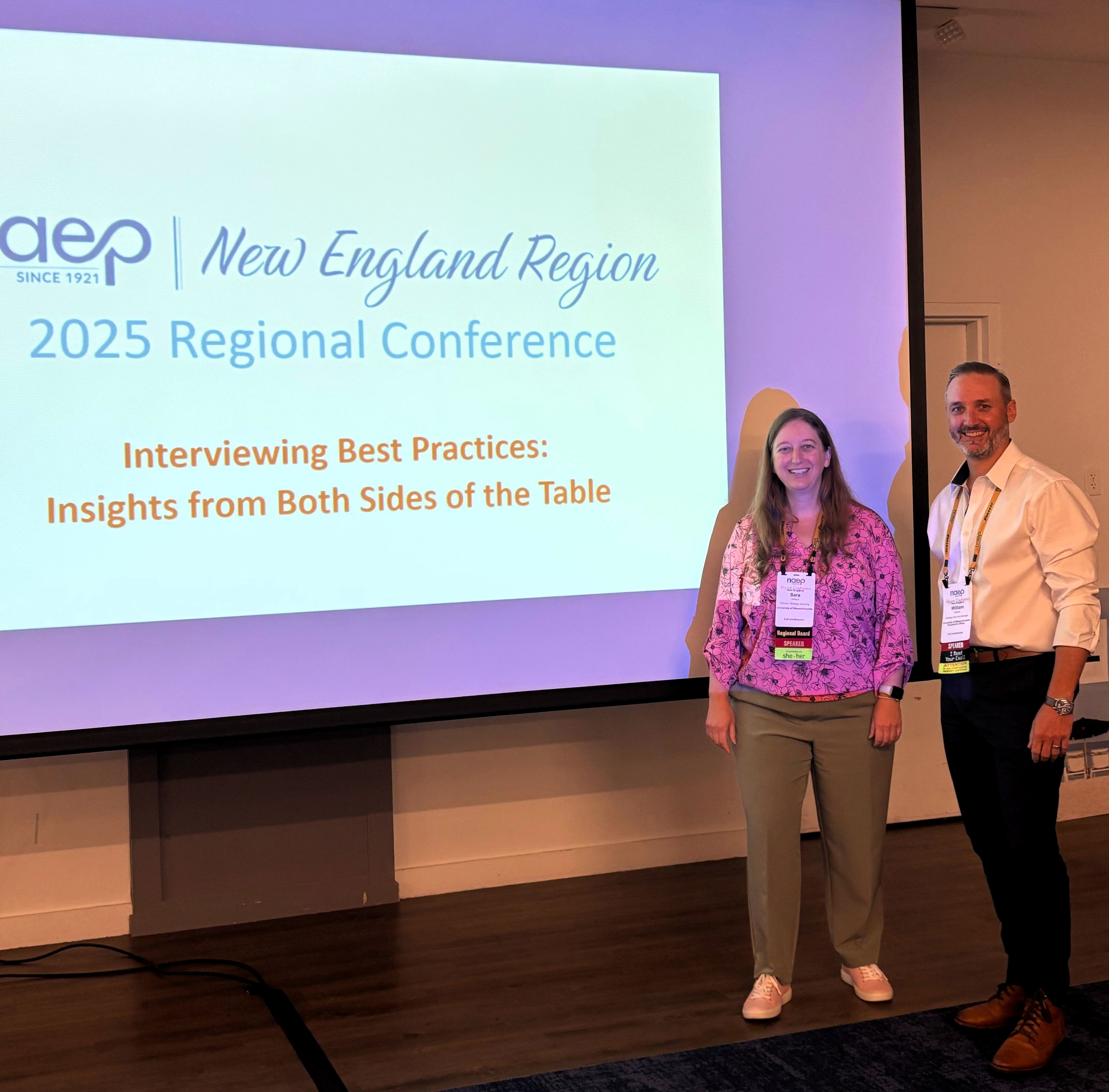 Sara Veilleux and Bill Mannix standing in front of a powerpoint that says New England Region 2025 Regional Conference, Interviewing Best Practices: Insights from Both Sides of the Table