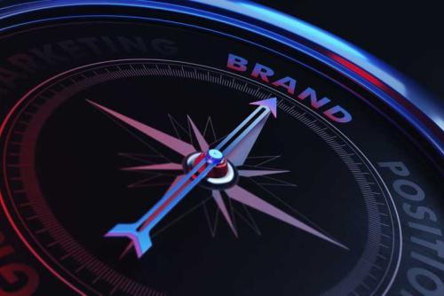 Compass pointing to brand text