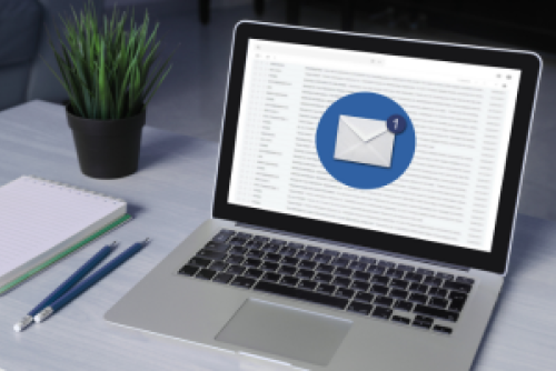 laptop with an email application showing on screen