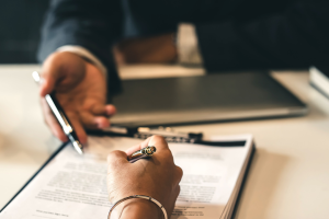 a person signing a document