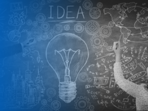 Chalkboard with brainstorm session of images and text surrounding a chalk drawn lightbulb and the word idea.
