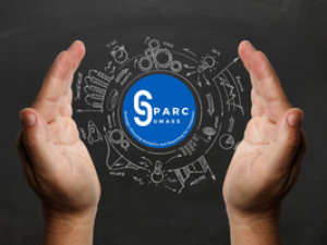 Hands surrounding a logo for SPARC with chalk drawings of a variety of charts and measurements