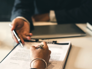 a person signing a document