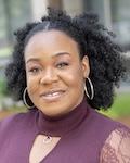 Student Trustee Elizabeth Osa-Agbontaen in a mauve shirt with neck covering